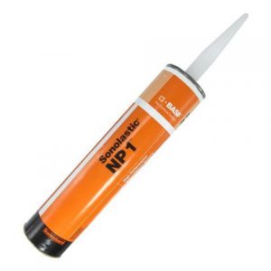 A cartridge of orange Soudal sealant with a white nozzle on a white background.