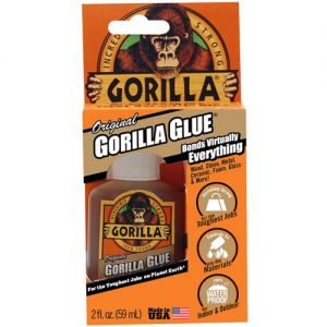 A bottle of Original Gorilla Glue adhesive with brand logo and product information on the packaging.