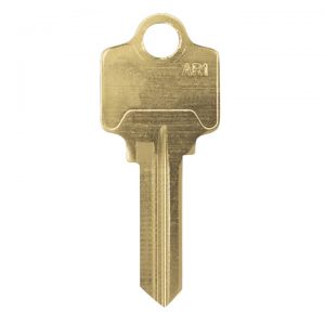 A single brass house key with a cut pattern isolated on a white background.