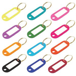 Assorted colorful key tags with blank white labels on a white background.