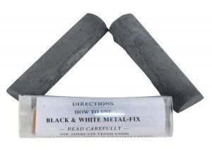 Two sticks of metal-fix epoxy putty above an instruction label.
