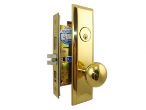 Gold-colored door handle with lock and keyhole on a white background.