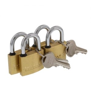 Four brass padlocks with keys on a white background.