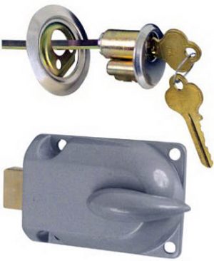 Key inserted in a door lock above an uninstalled similar lock.