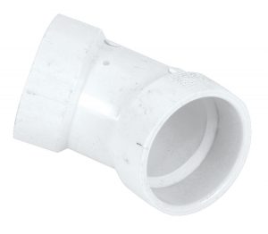White PVC elbow pipe joint on a plain background.