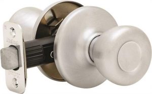A satin nickel door knob with a lock mechanism, isolated on a white background.