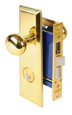 Gold-colored door knob on a lockset with keyhole, isolated against a white background.