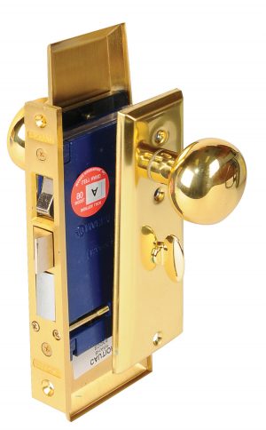 Gold-colored door lock assembly isolated on a white background.