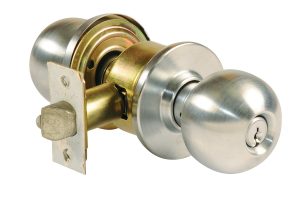 A metal door knob with a keyhole on a latch mechanism, isolated on a white background.