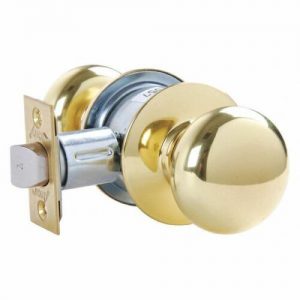 Brass round doorknob with latch mechanism on a white background.