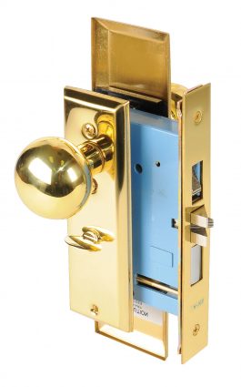 Gold doorknob on blue door lock mechanism, isolated on white.