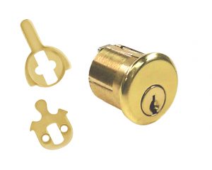 A brass cylinder lock and keys on a white background.