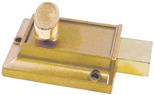 A brass sliding door lock on a white background.