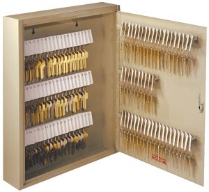 A wall-mounted key storage cabinet with multiple rows of numbered keys.