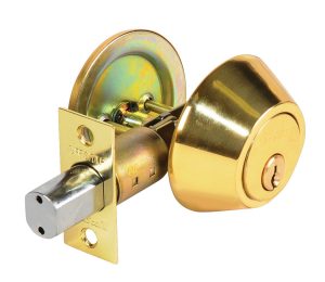 Brass deadbolt lock and cylinder isolated on white background.