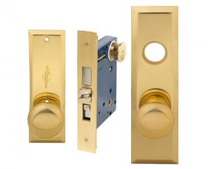 Gold door deadbolt lock parts isolated on a white background.