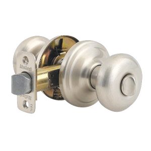 A satin nickel door knob with a lock mechanism on a white background.