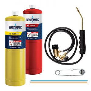 Welding equipment with MAPP gas cylinder, oxygen tank, torch handle, hose, and igniter.