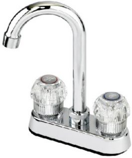 Chrome twin-handle kitchen faucet with clear acrylic knobs on a white background.