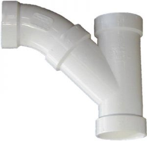 White PVC pipe fitting with a 90-degree elbow and a T-junction.