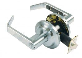 Stainless steel door handle and lock set with latch and key mechanism visible.