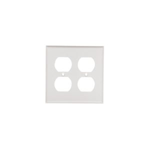 A white quadruple electrical outlet wall plate isolated on a white background.