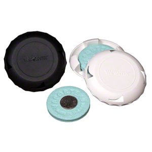 Two Vicks VapoRub inhalers, one black and one white, with an open cap and refill pad visible.