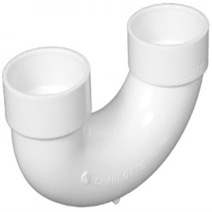White PVC P-trap pipe for plumbing on a light background.