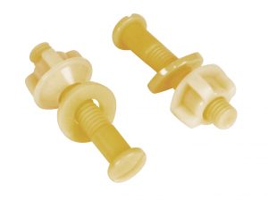 Two yellow plastic nuts and bolts on a white background.