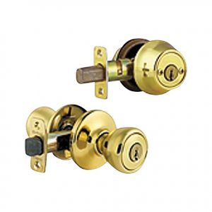 Three brass door knobs with keyholes on a white background.