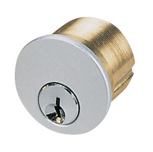 A metal drawer or door lock cylinder with a keyhole on a white background.