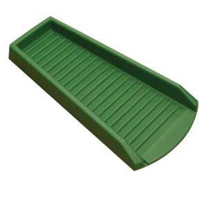 Green plastic sledge isolated on a white background.