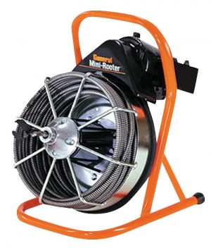 A portable drain cleaning machine with a coiled cable on an orange frame.
