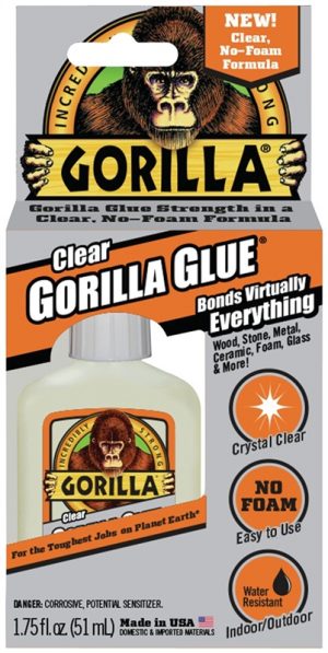 Packaging of Clear Gorilla Glue with a gorilla image, touting strength and versatility for bonding.
