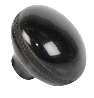 A black, round cabinet knob with a smooth finish, isolated on a white background.