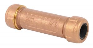 Copper pipe coupling fitting on a white background.