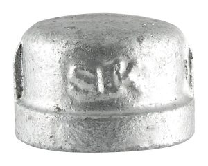 Close-up of a metal cap with embossed text detail on the surface.