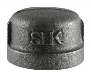 Close-up of a metal pipe cap with "SLK" embossed on the top.