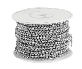 A spool of silver beaded chain on a white background.