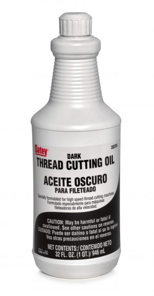 A bottle of Oatey dark thread cutting oil with warning and net contents information.