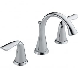 Chrome bathroom faucet with two handles isolated on white background.
