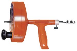 An orange tag applicator gun used for attaching pricing labels to clothing.