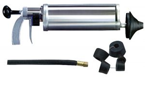 Metal grease gun with flexible hose and additional black fittings on a white background.