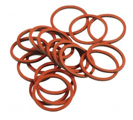 A pile of scattered red rubber bands on a white background.