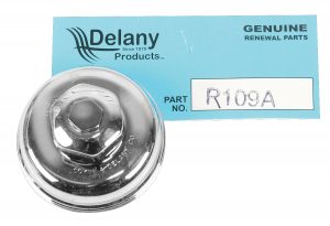 A shiny metal plumbing fixture part labeled "R109A" on a blue Delany Genuine Parts card.