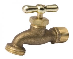 Brass outdoor faucet with a cross handle isolated on white background.