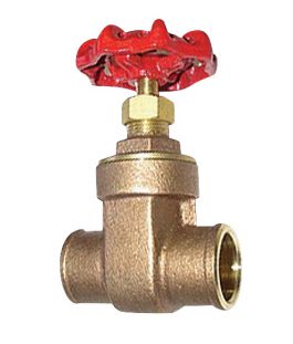 Brass gate valve with a red wheel handle isolated on a white background.