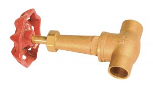 A brass fire hydrant valve with a red hand wheel on a white background.