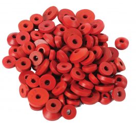 A pile of red rubber stoppers with various sizes and numbers stamped on them.