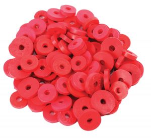 A pile of red circular plastic discs with numbers embossed on them.